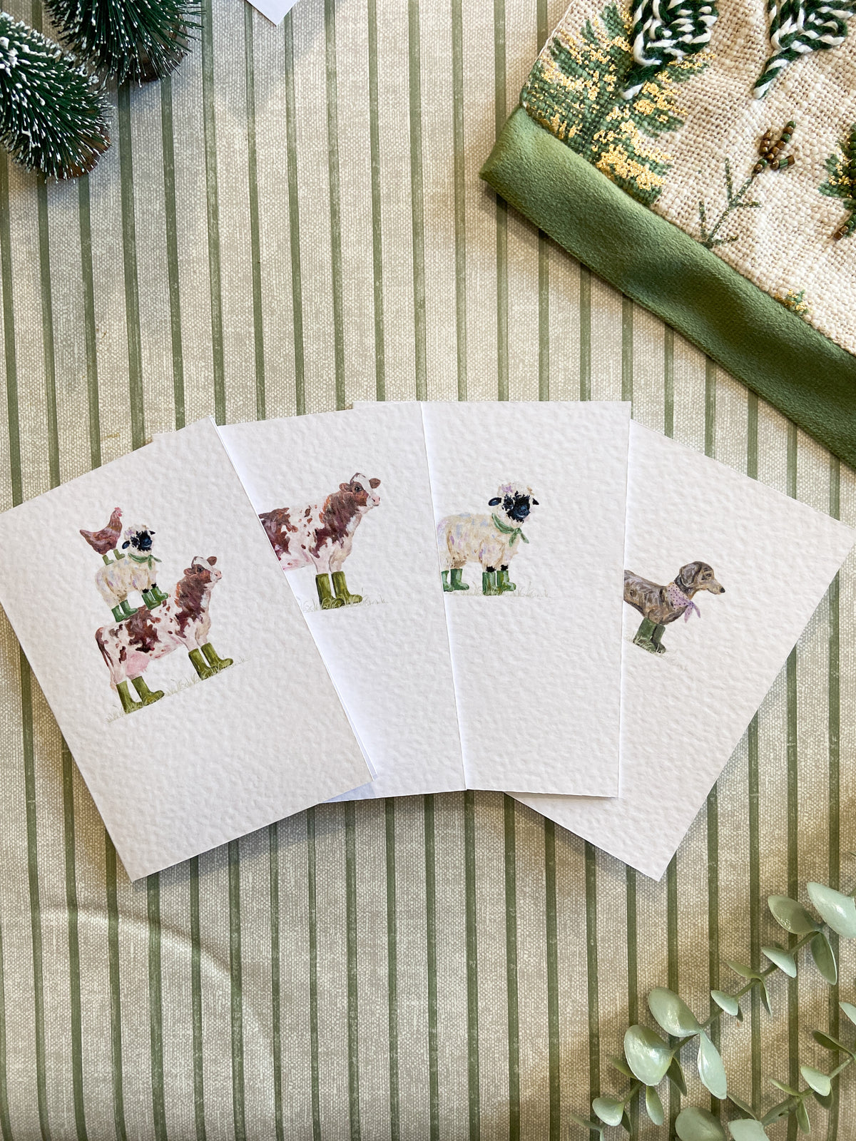 Farm animal greeting card featuring quirky illustrated farm animals wearing colourful wellies, original artwork by H. Watterson Art.