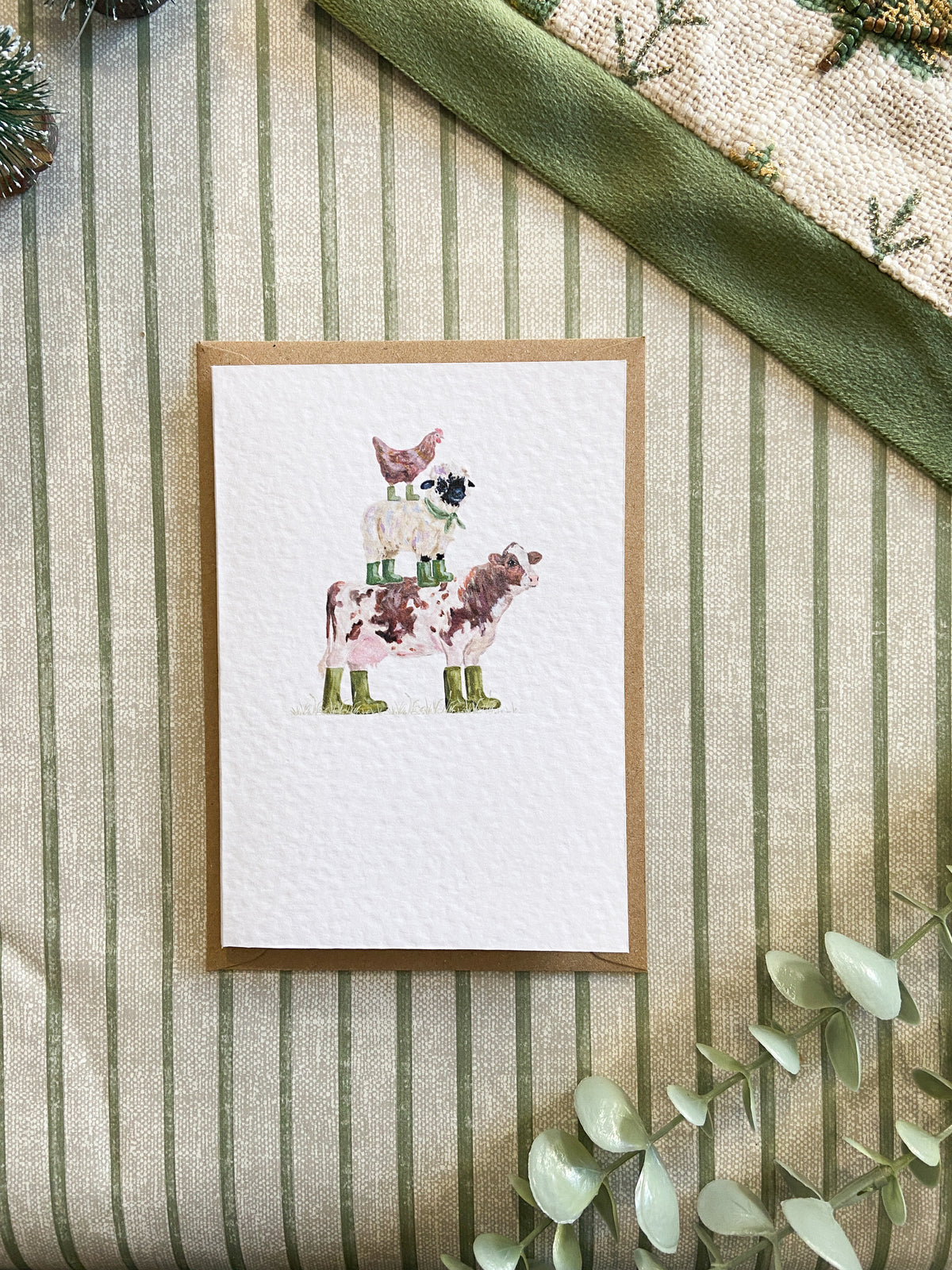 Farm animal greeting card featuring quirky illustrated farm animals wearing colourful wellies, original artwork by H. Watterson Art.