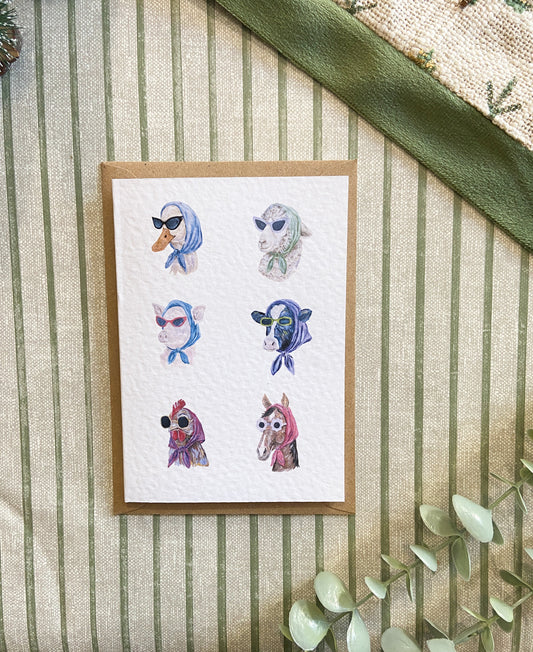 Farm animal greeting card featuring quirky illustrated cows, sheep and other farm animals wearing sunglasses, original artwork by H. Watterson Art.